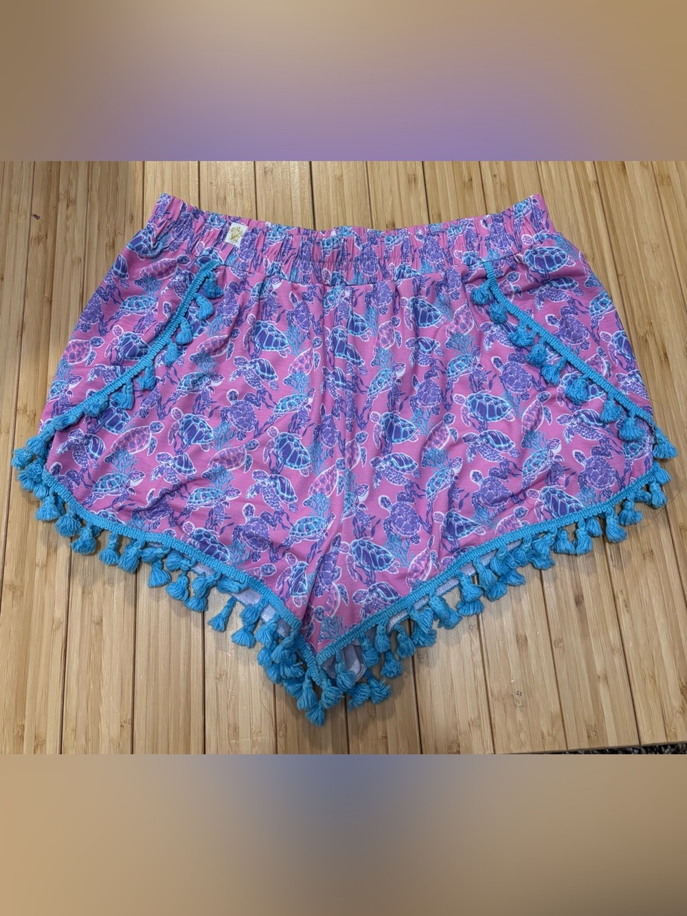Turtle print tassel accent women’s shorts. Size S. Built in panty.